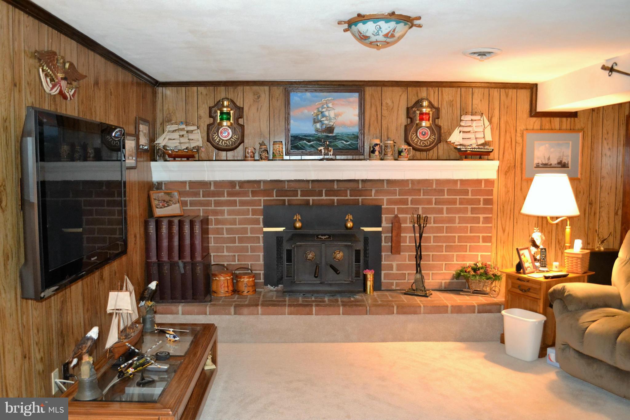 6421 Chell Road Columbia, MD 21044 - Photo 18 of 25 a living room with furniture and a fireplace