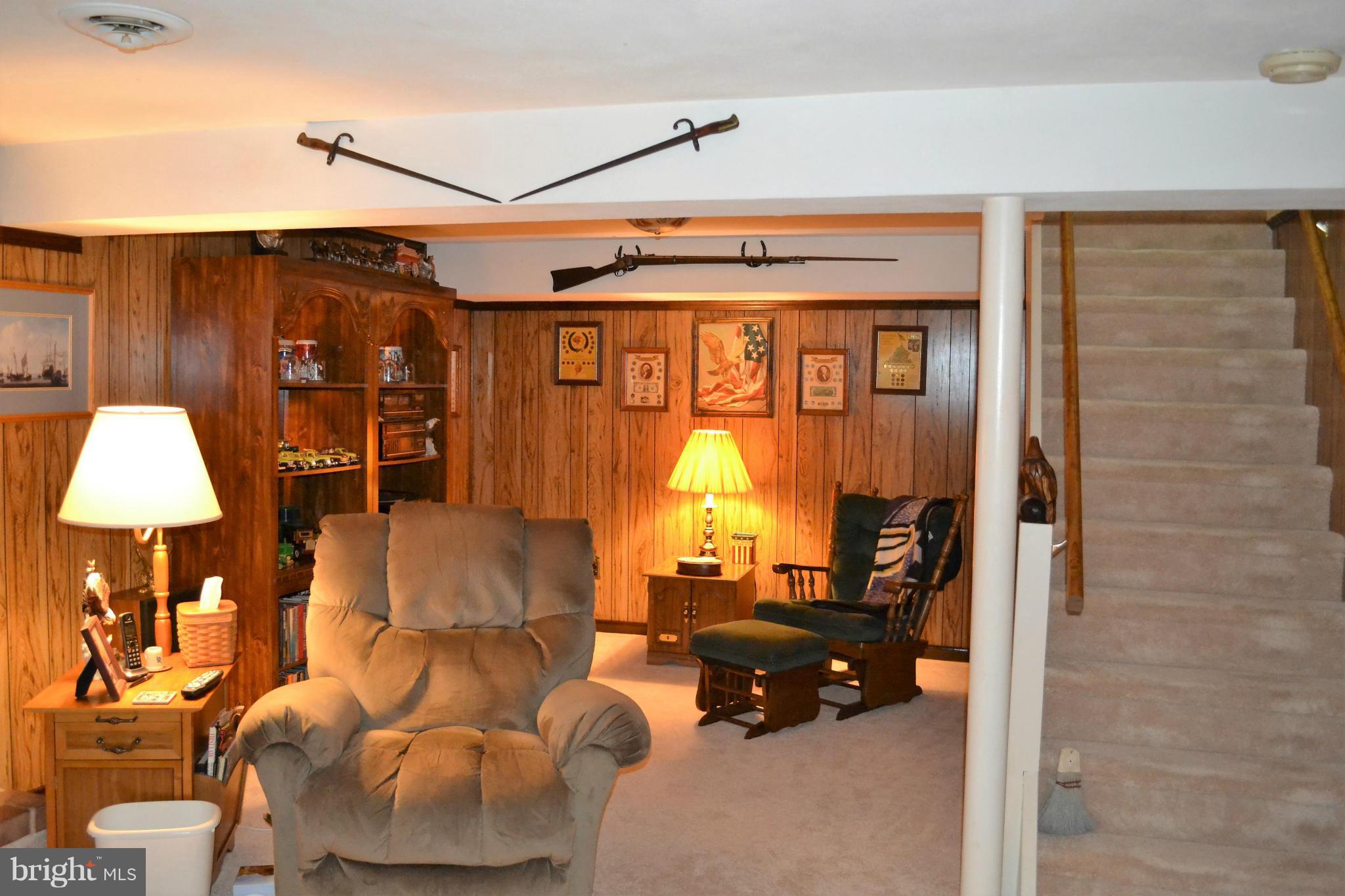 6421 Chell Road Columbia, MD 21044 - Photo 19 of 25 a living room with furniture and a flat screen tv