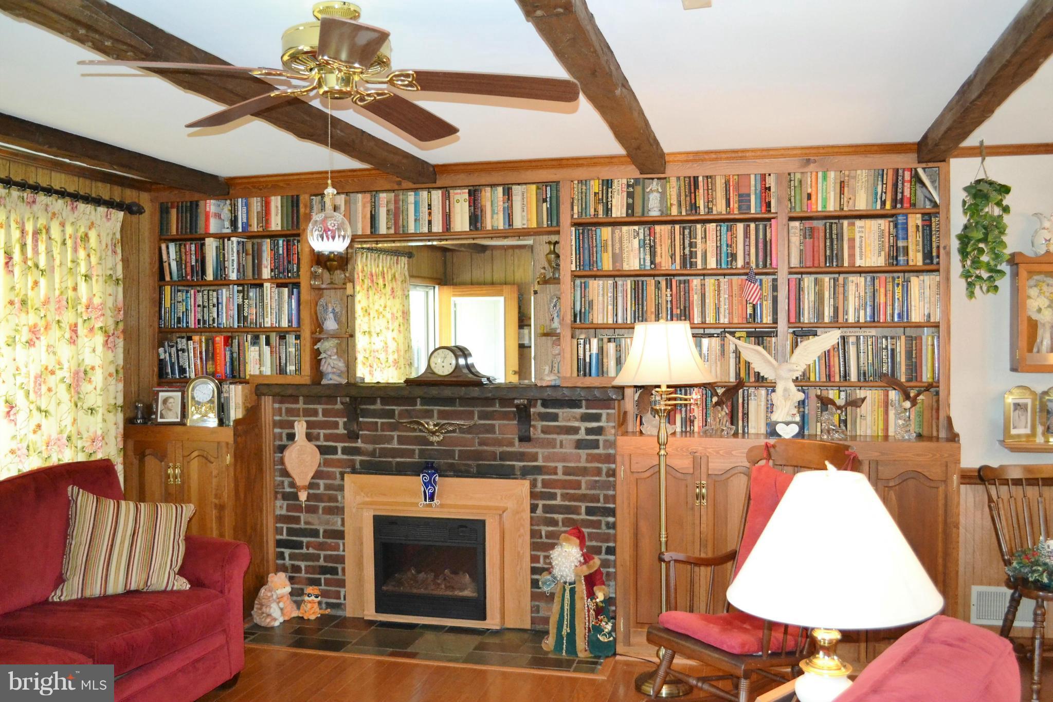 6421 Chell Road Columbia, MD 21044 - Photo 8 of 25 a living room with furniture and a fireplace