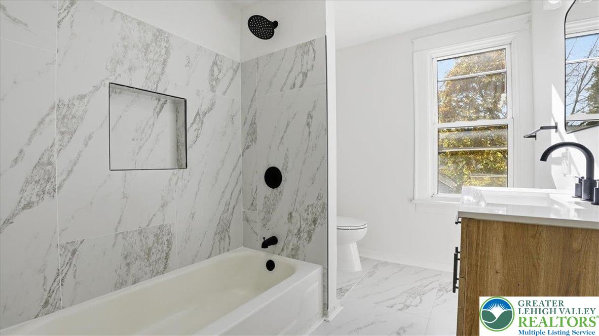 322 East Garrison Street Bethlehem, PA 18018 - Photo 11 of 24 a bathroom with a bathtub and a shower