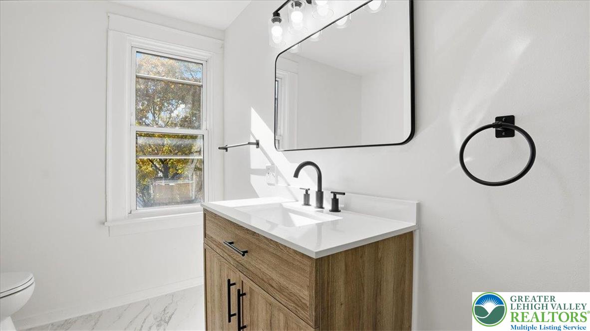 322 East Garrison Street Bethlehem, PA 18018 - Photo 12 of 24 a bathroom with a sink and a mirror