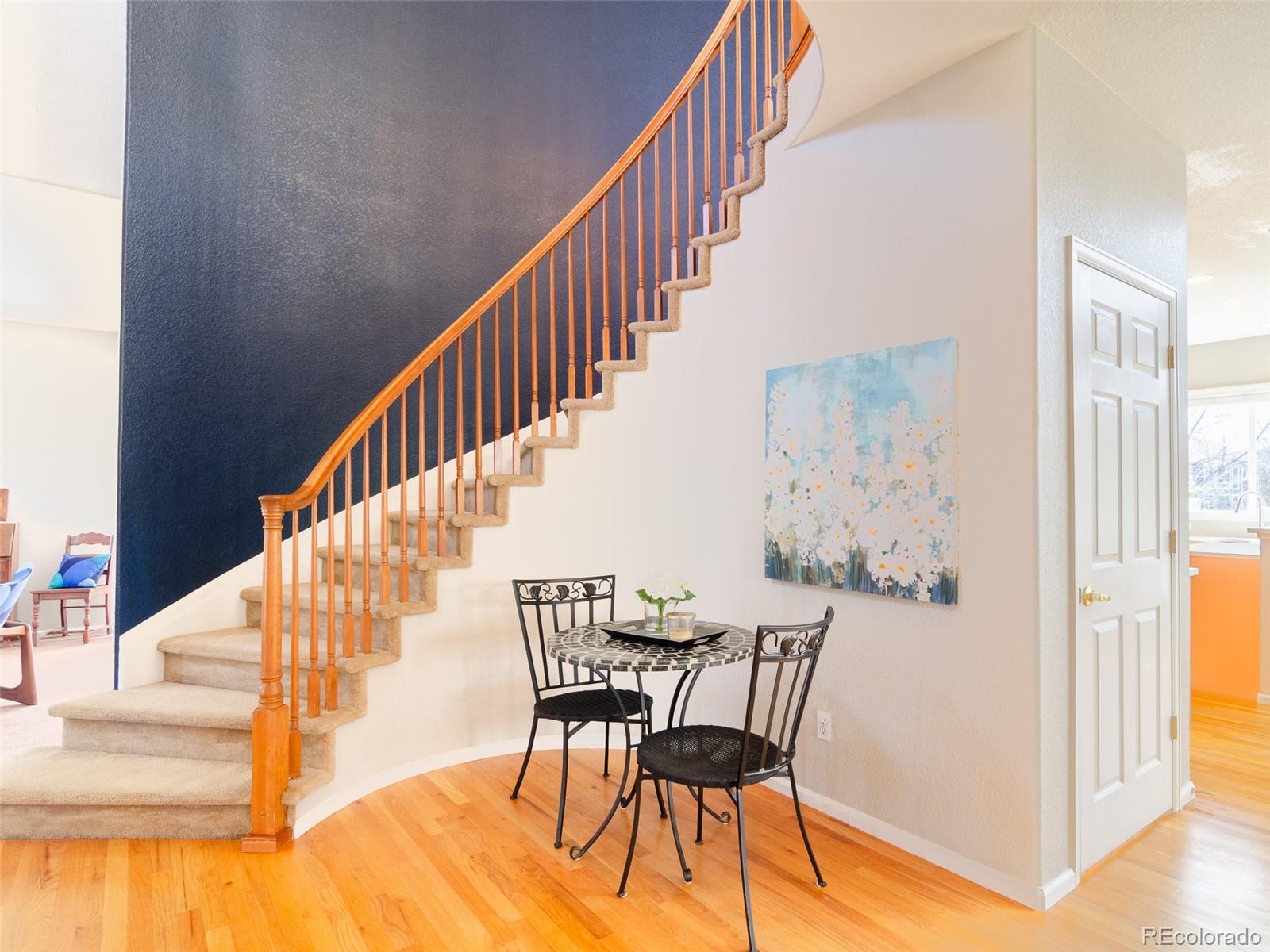 2080 Pearl Howlett Road Longmont, CO 80504 - Photo 14 of 46 a view of entryway and hall with wooden floor