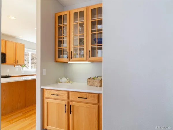 a kitchen with a sink cabinets and a window