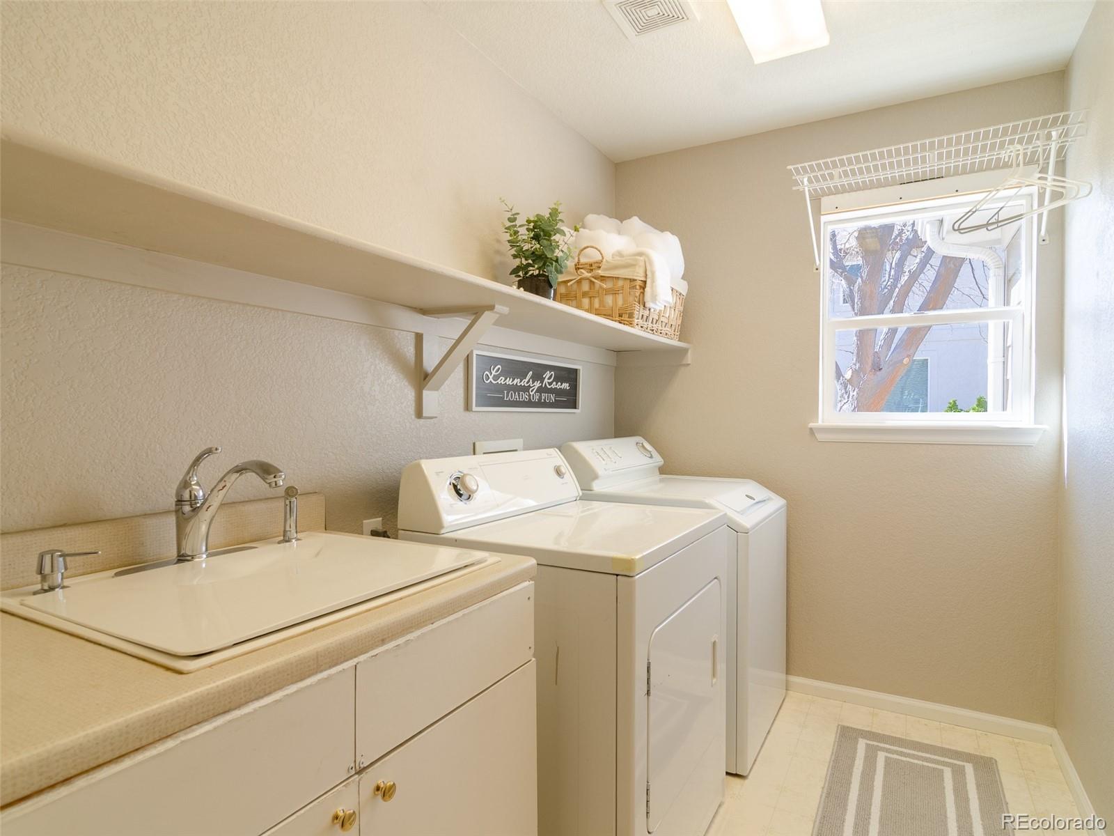 2080 Pearl Howlett Road Longmont, CO 80504 - Photo 30 of 46 a utility room with dryer and washer