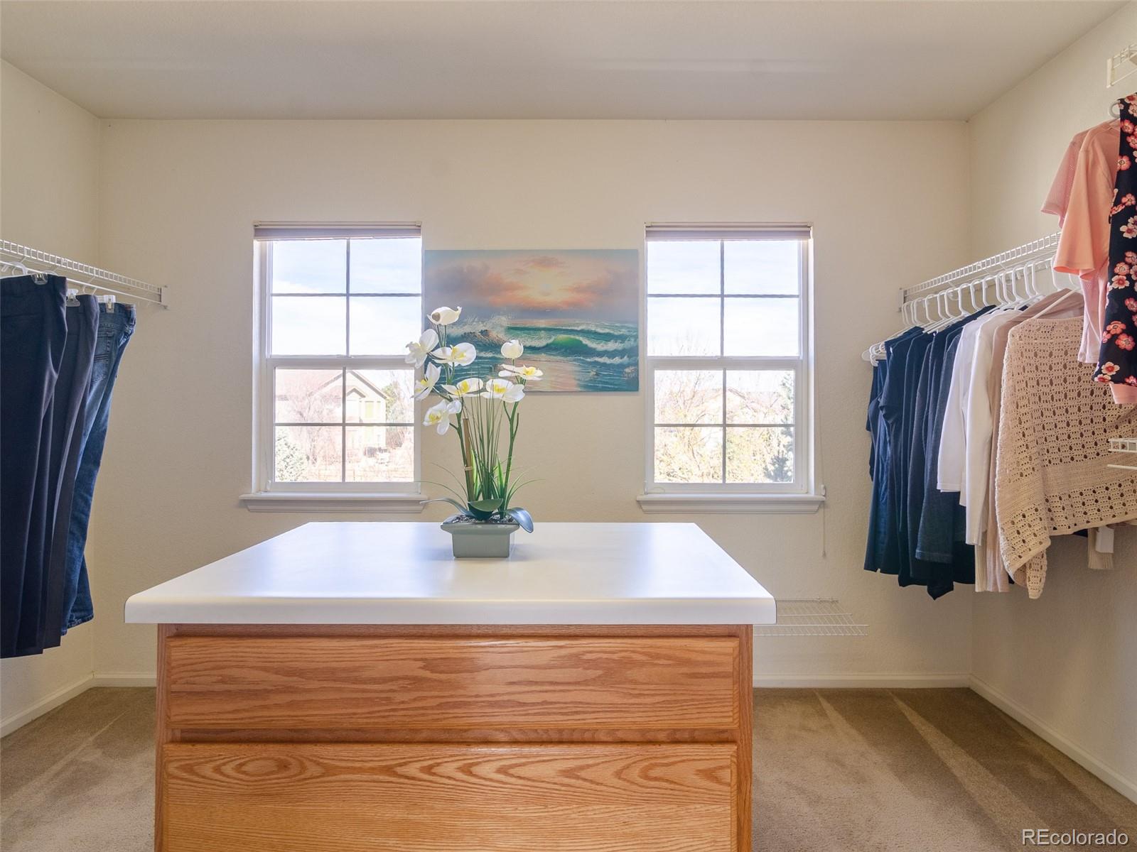 2080 Pearl Howlett Road Longmont, CO 80504 - Photo 39 of 46 a view of kitchen with windows and refrigerator
