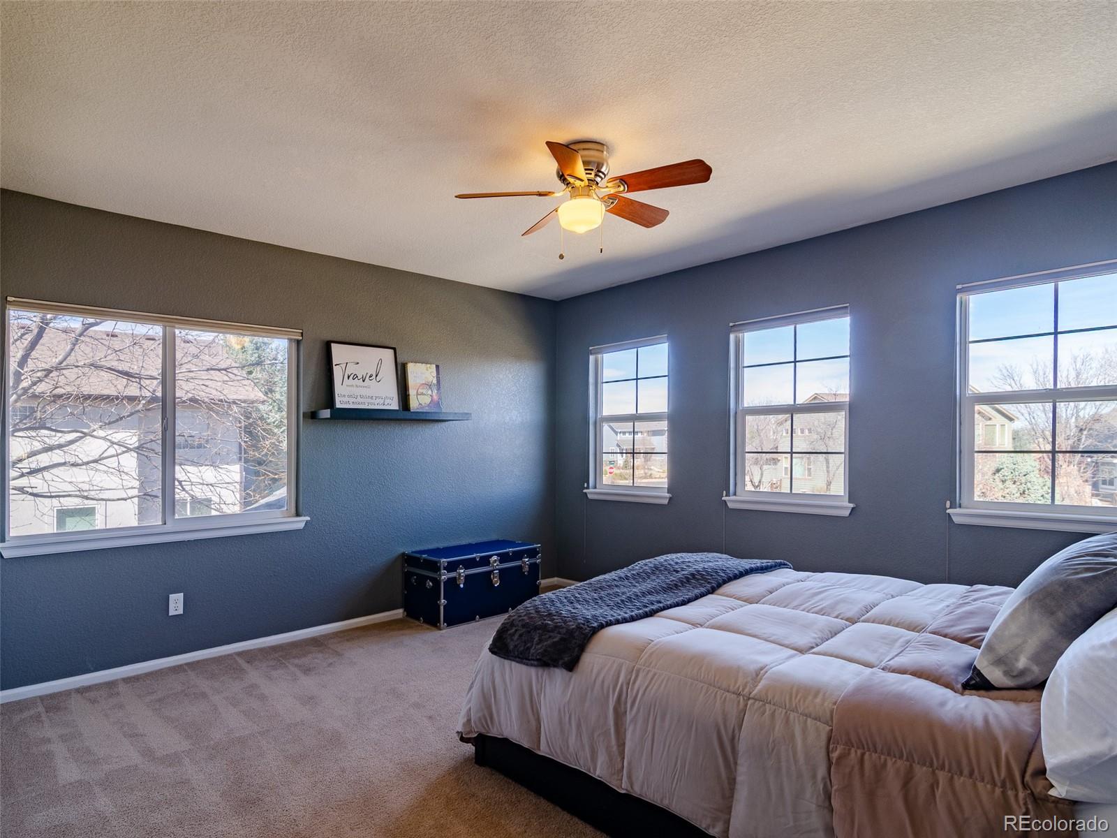 2080 Pearl Howlett Road Longmont, CO 80504 - Photo 42 of 46 a bedroom with a bed and a window