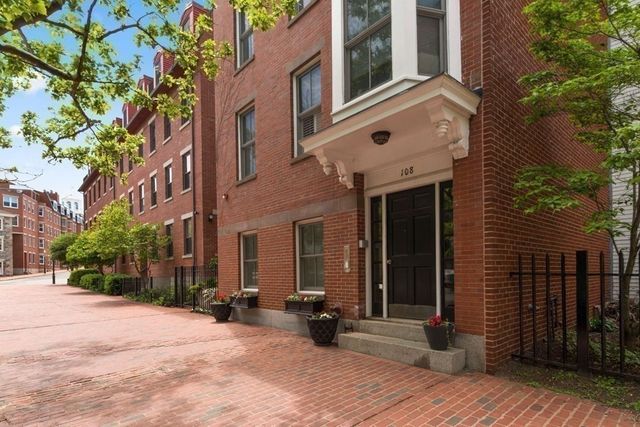 a view of a building with sitting area