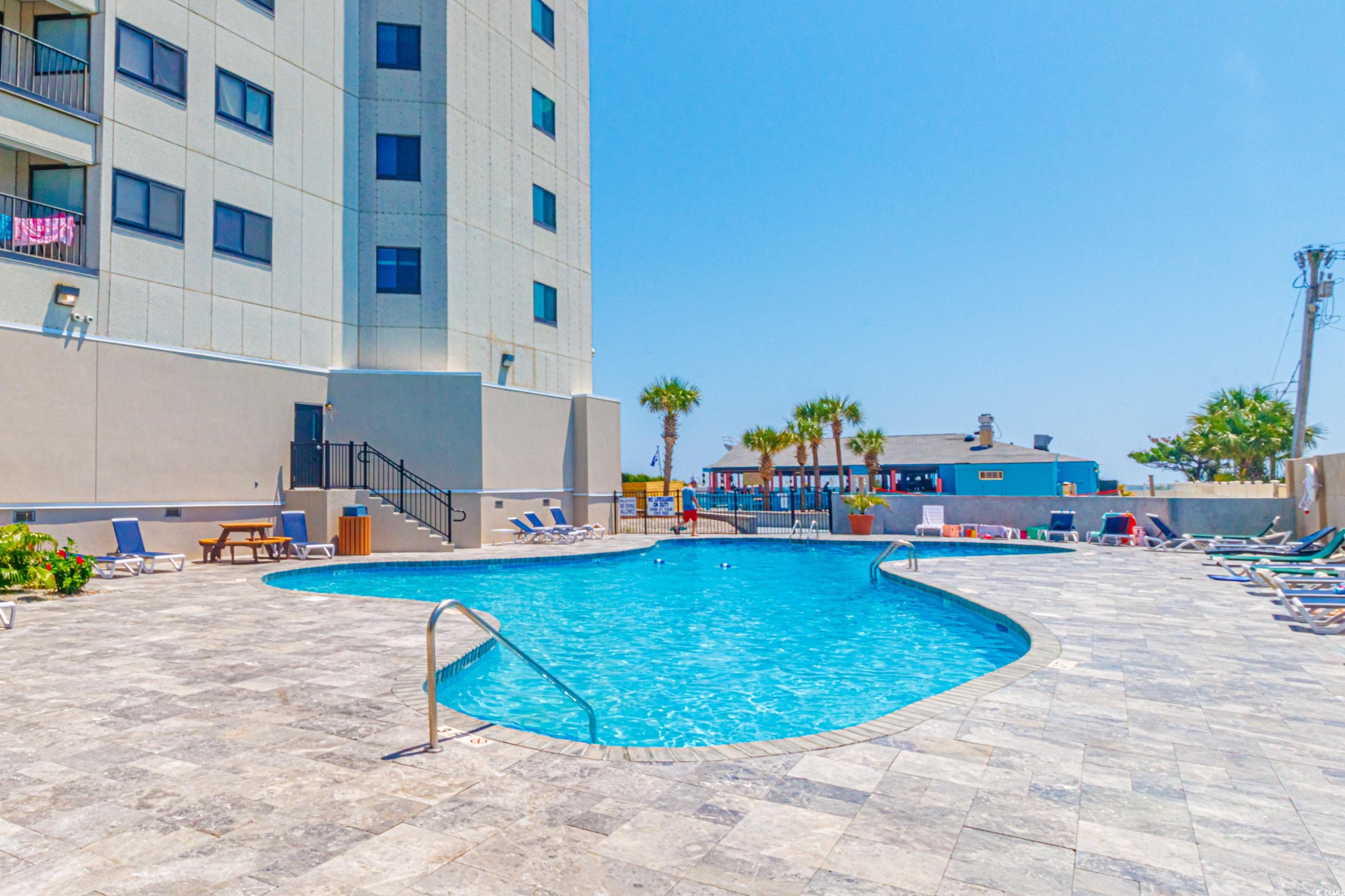 5905 South Kings Highway, Unit 4215 Myrtle Beach, SC 29575 - Photo 26 of 40 Community pool featuring a patio