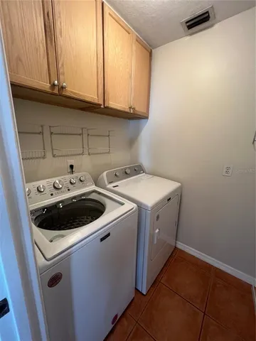 a view of a room with a sink window and wooden floor