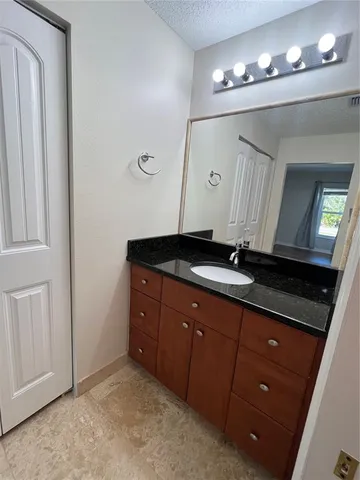 a white toilet sitting next to a bath tub and a shower