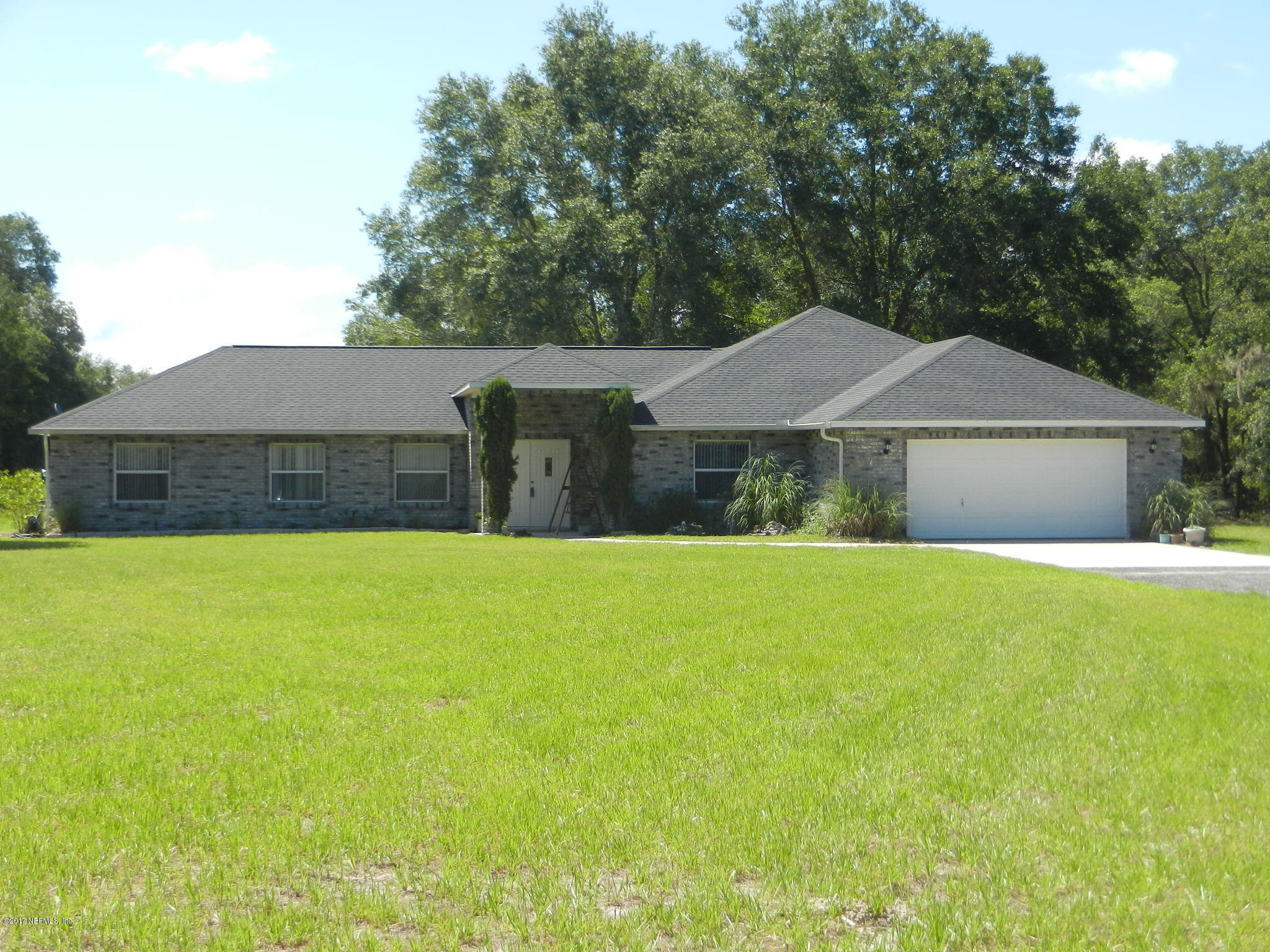 2205 Brownlee Road Seville, FL 32190 - Photo 1 of 27 a house view with a garden space