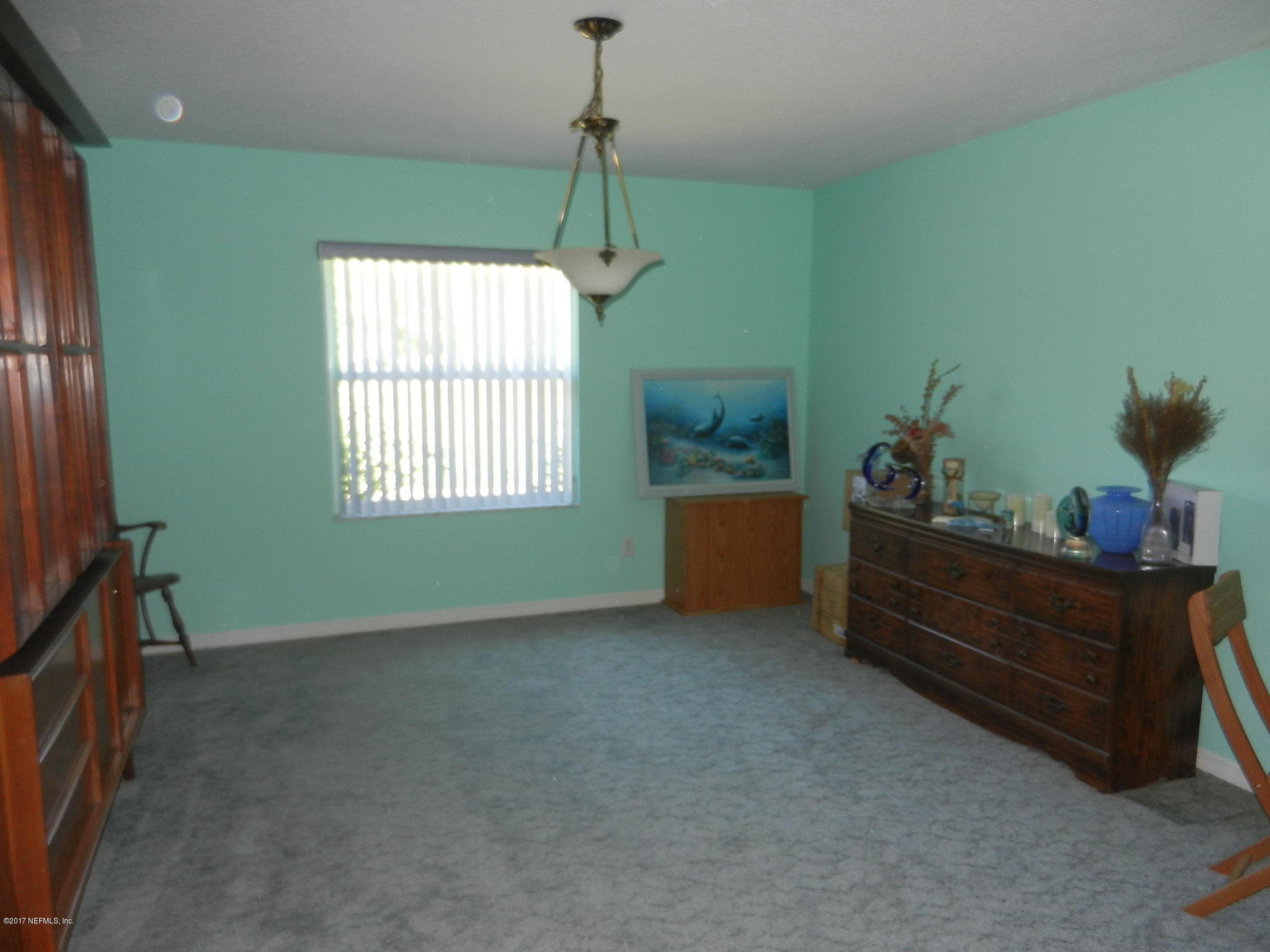 2205 Brownlee Road Seville, FL 32190 - Photo 12 of 27 a room with furniture and window