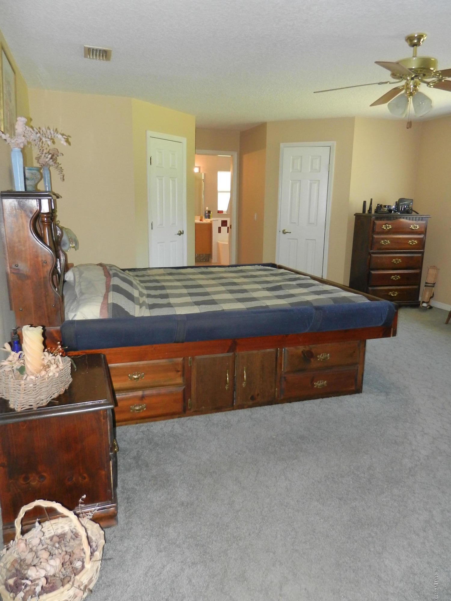2205 Brownlee Road Seville, FL 32190 - Photo 15 of 27 a spacious bedroom with a bed and a dresser
