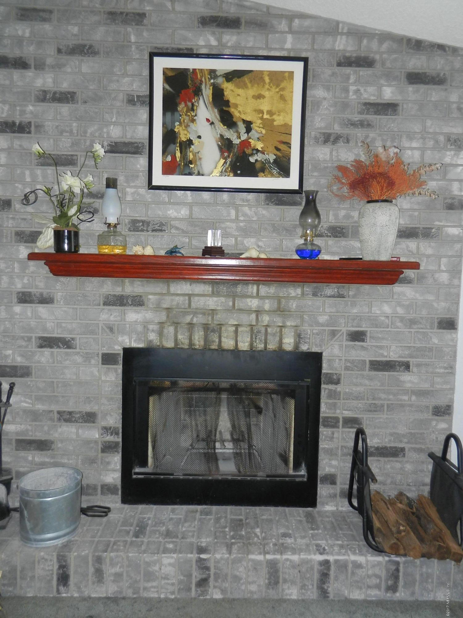 2205 Brownlee Road Seville, FL 32190 - Photo 5 of 27 a fireplace with a clock on wall