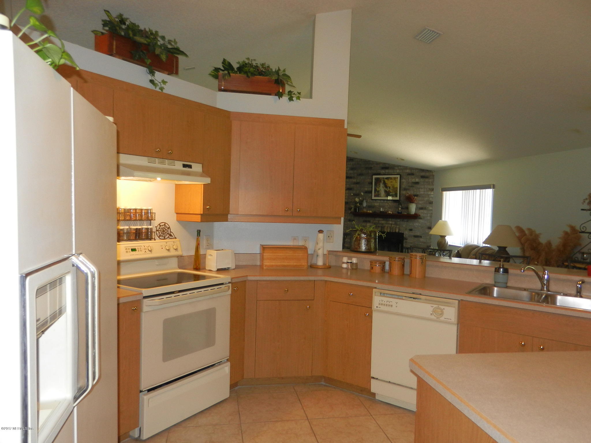 2205 Brownlee Road Seville, FL 32190 - Photo 10 of 27 a kitchen with a sink and white cabinets