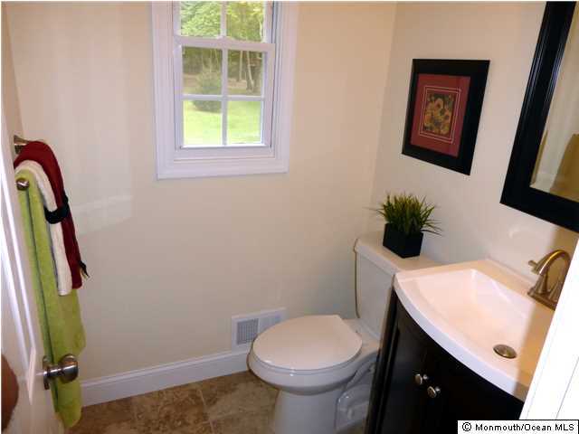346 Diamond Road Jackson, NJ 08527 - Photo 11 of 23 a bathroom with a toilet a sink and a window