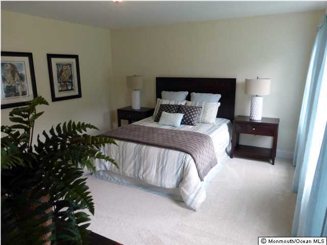 346 Diamond Road Jackson, NJ 08527 - Photo 14 of 23 a bedroom with a bed and a potted plant