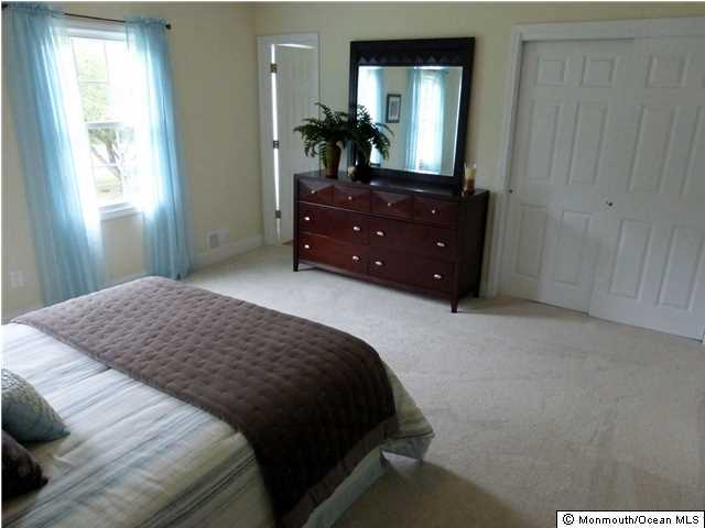 346 Diamond Road Jackson, NJ 08527 - Photo 15 of 23 a bedroom with a bed and a mirror