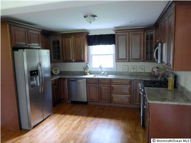346 Diamond Road Jackson, NJ 08527 - Photo 2 of 23 a kitchen with granite countertop a refrigerator stove top oven and sink