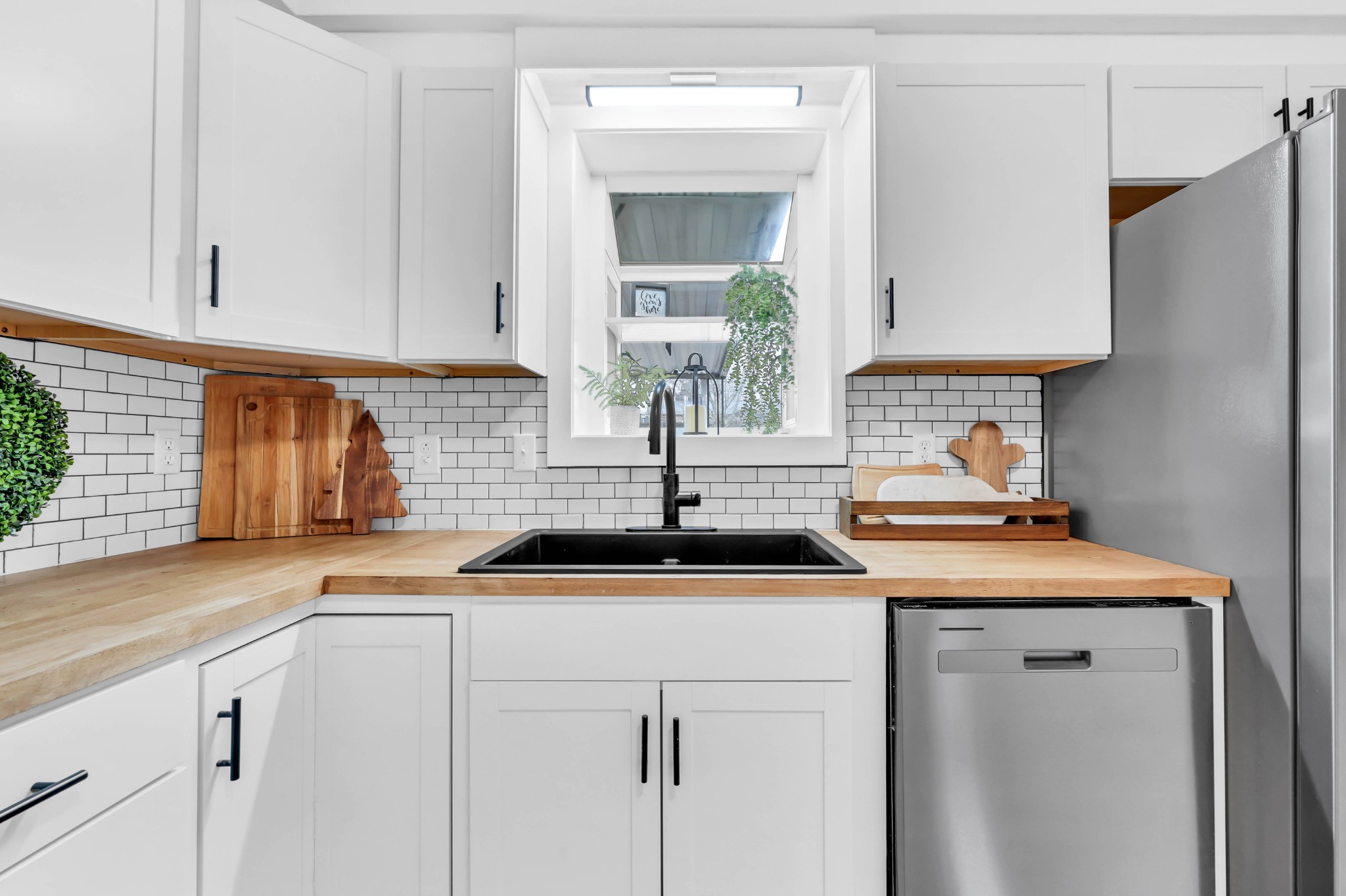 219 Jordan Road Clarksville, TN 37042 - Photo 11 of 22 a kitchen with stainless steel appliances granite countertop a sink and a white cabinets