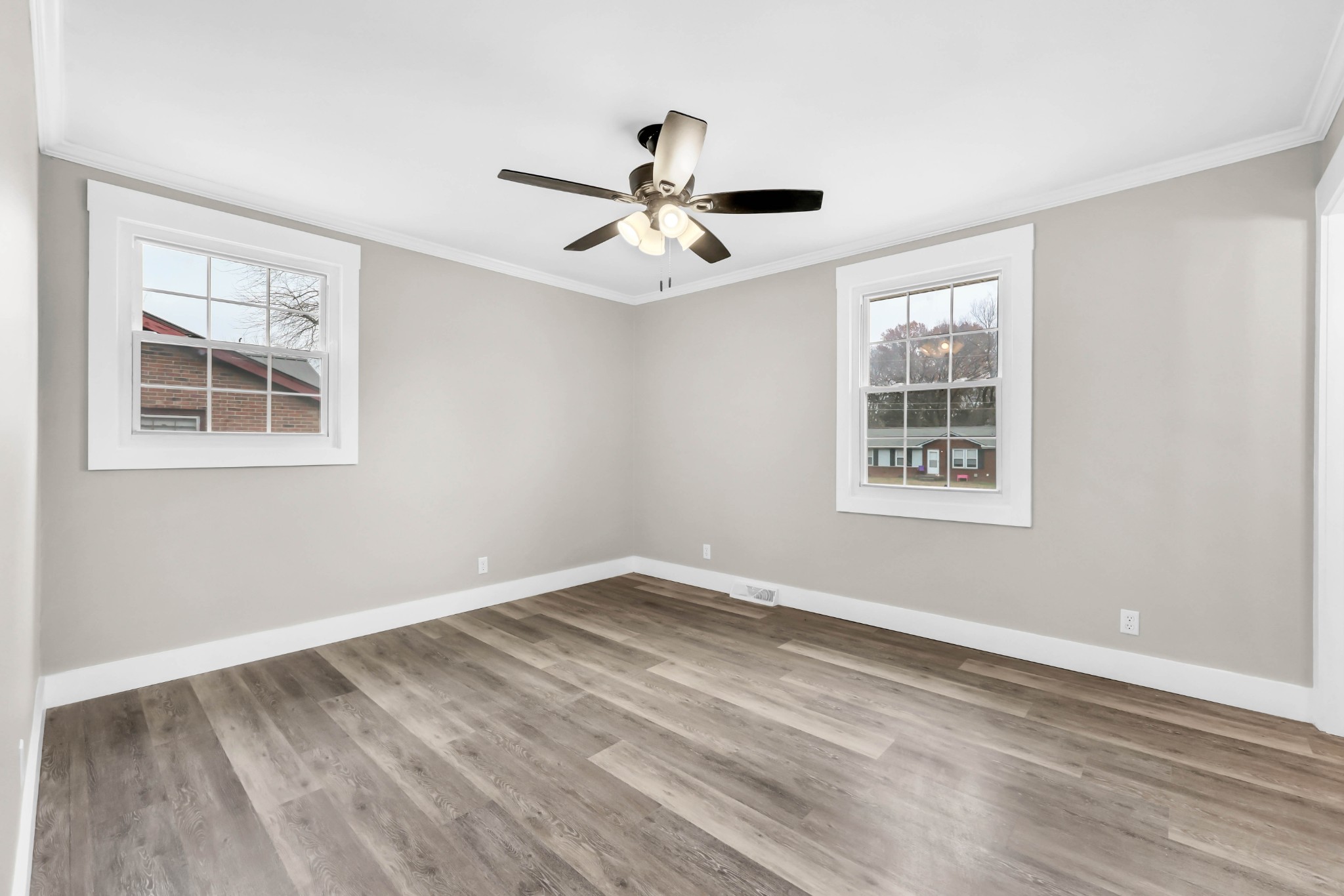 219 Jordan Road Clarksville, TN 37042 - Photo 13 of 22 a view of empty room with wooden floor and ceiling fan