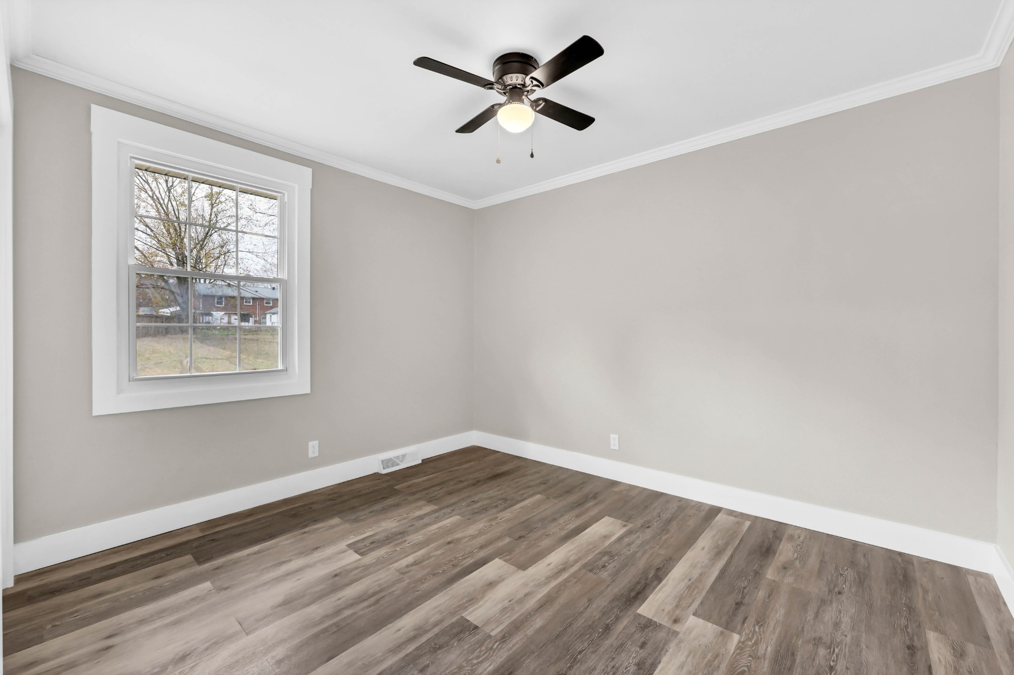 219 Jordan Road Clarksville, TN 37042 - Photo 15 of 22 an empty room with wooden floor and windows