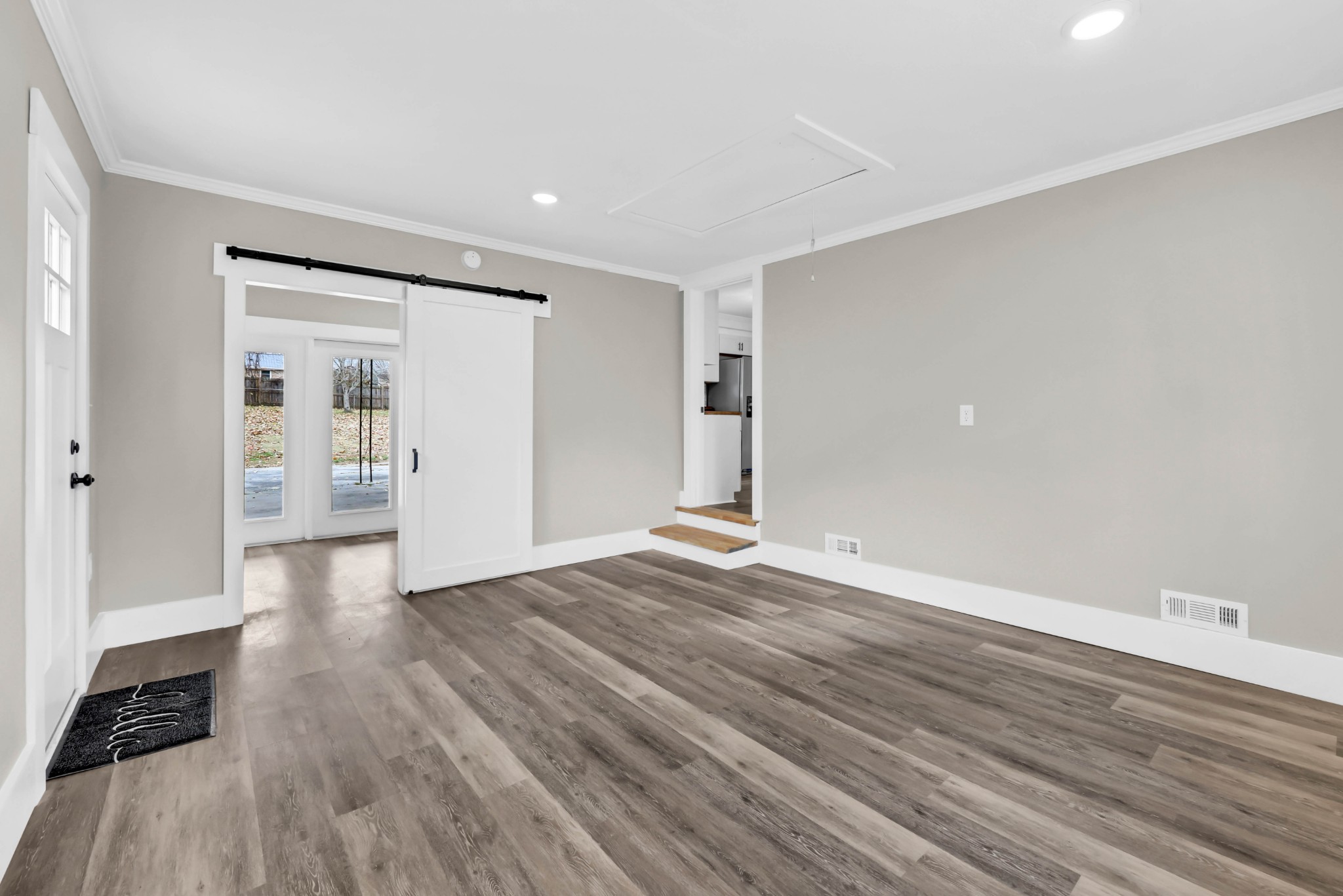 219 Jordan Road Clarksville, TN 37042 - Photo 17 of 22 a view of an empty room with wooden floor and a window