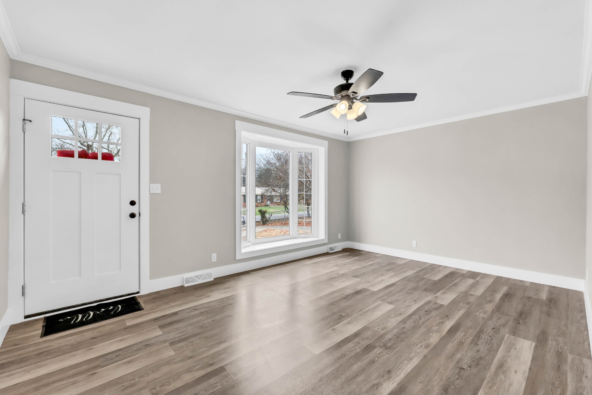 219 Jordan Road Clarksville, TN 37042 - Photo 4 of 22 wooden floor in an empty room with a window