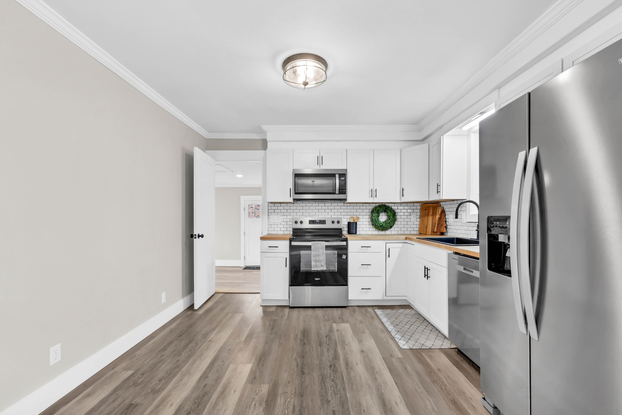 219 Jordan Road Clarksville, TN 37042 - Photo 8 of 22 a kitchen with white cabinets and stainless steel appliances