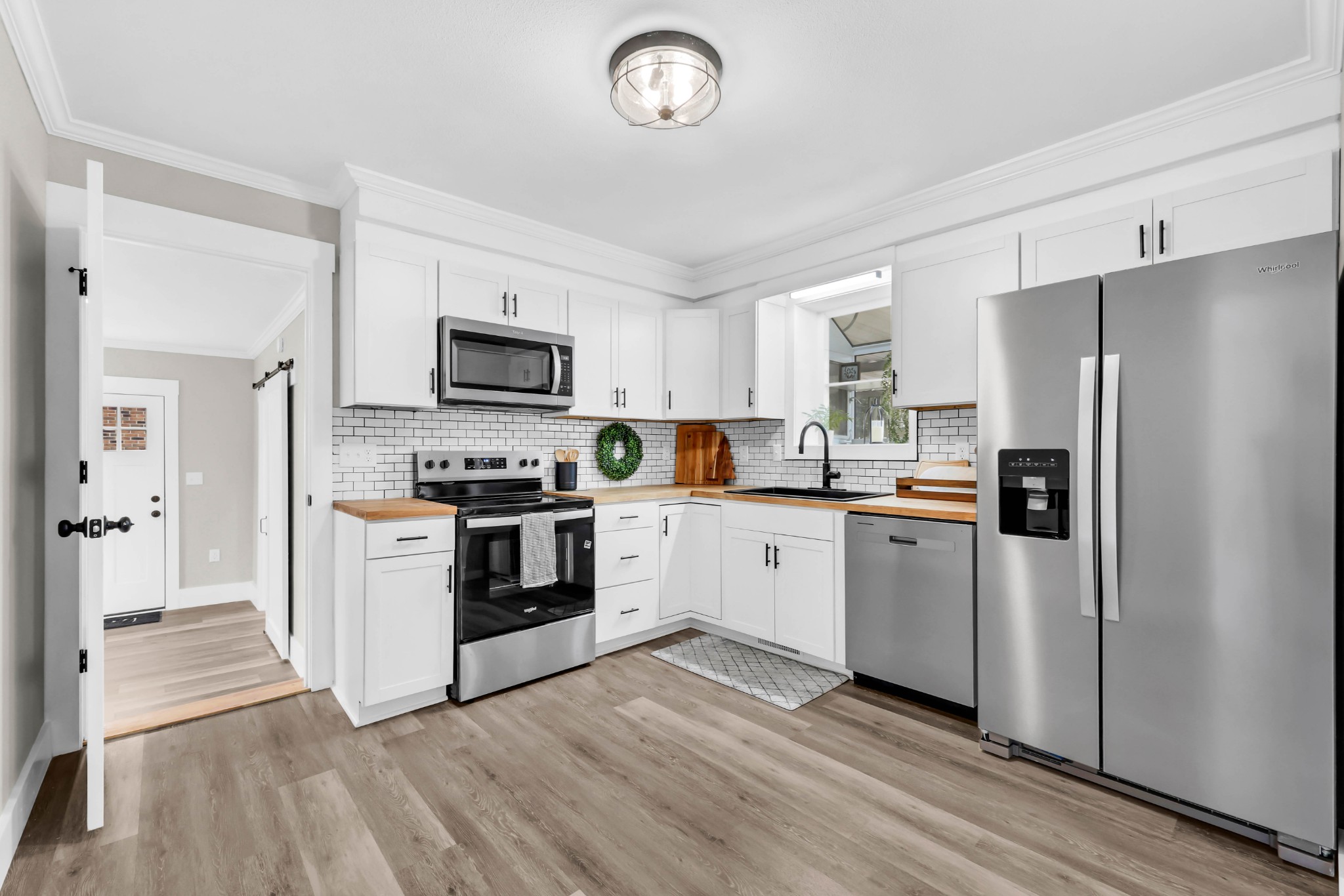 219 Jordan Road Clarksville, TN 37042 - Photo 9 of 22 a kitchen with granite countertop a refrigerator stove top oven and sink