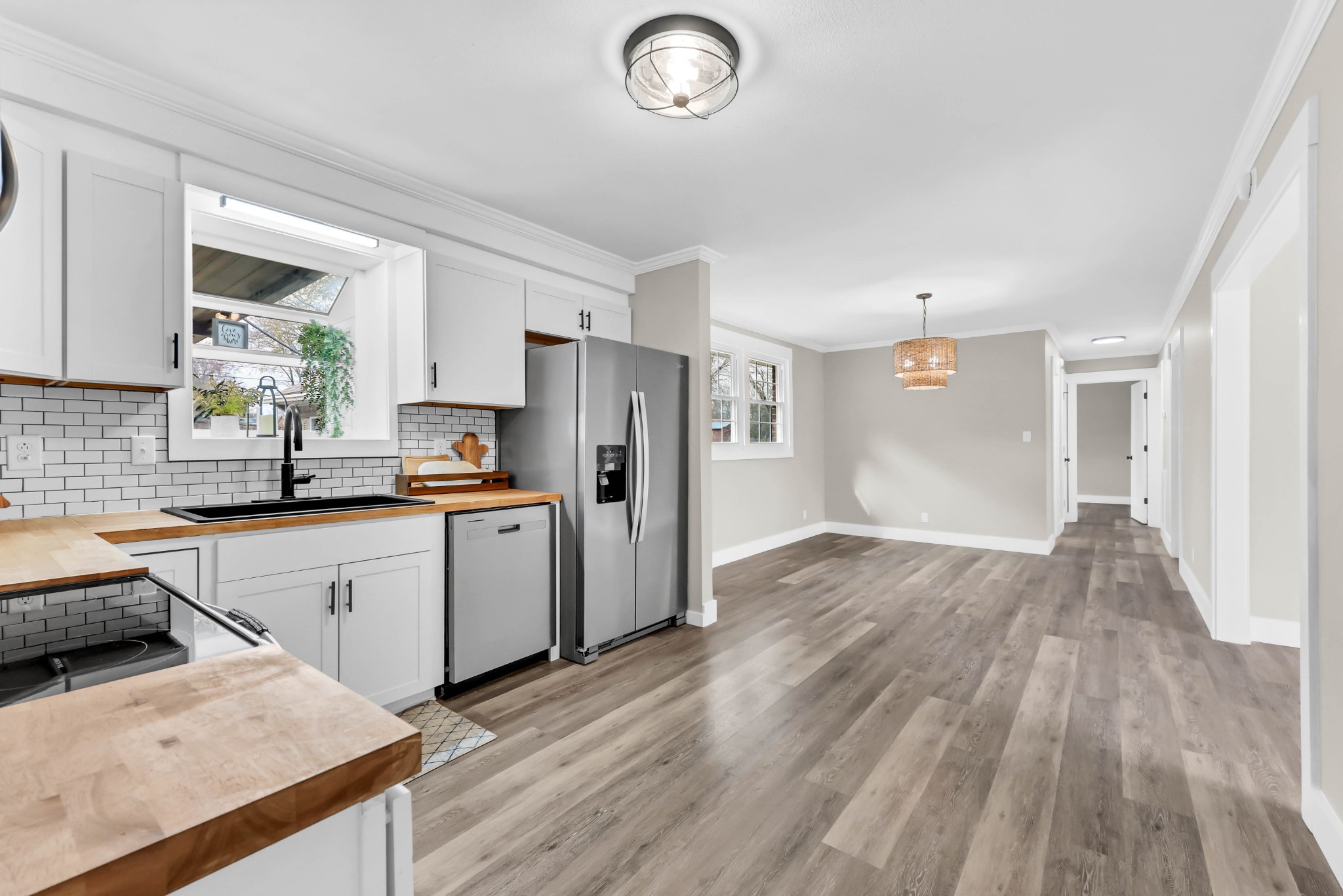 219 Jordan Road Clarksville, TN 37042 - Photo 10 of 22 a kitchen with a sink a refrigerator and wooden floor