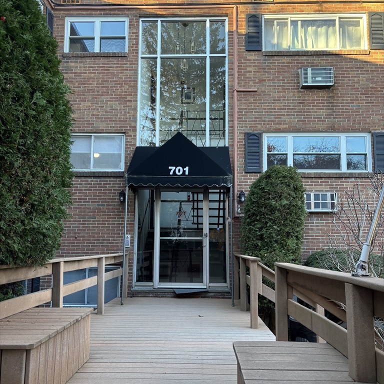 701 Adams Street, Unit 9 Boston, MA 02122 - Photo 1 of 19 a front view of a house with a yard