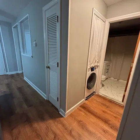 a view of a storage and utility room with a sink