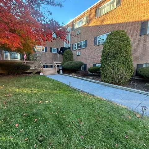 a view of a house with a back yard