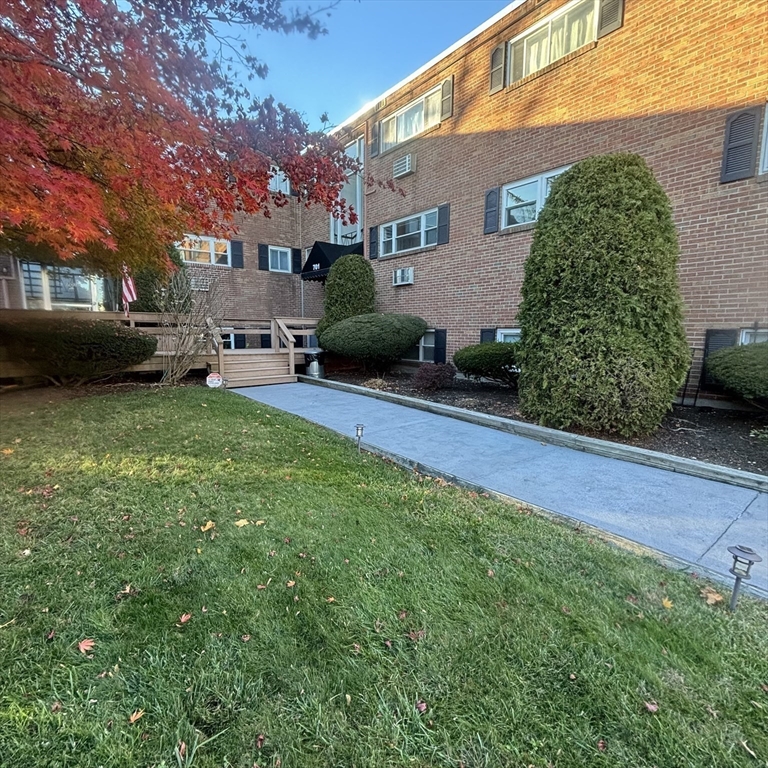 701 Adams Street, Unit 9 Boston, MA 02122 - Photo 17 of 19 a view of a house with a back yard