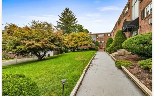 a view of a garden with a building