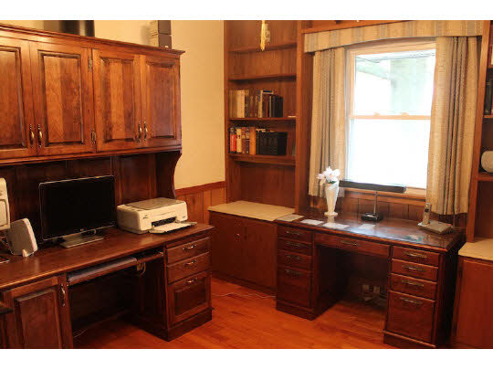4807 Mohawk Road Rockford, IL 61107 - Photo 11 of 11 a kitchen with granite countertop a sink and wooden cabinets