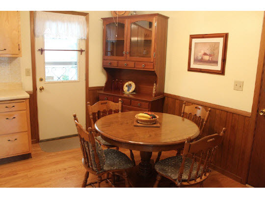 4807 Mohawk Road Rockford, IL 61107 - Photo 5 of 11 a dining room with furniture and window