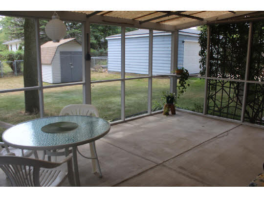 4807 Mohawk Road Rockford, IL 61107 - Photo 8 of 11 a backyard of a house with barbeque oven table and chairs