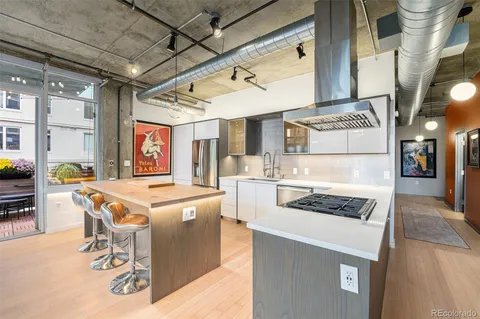 a kitchen that has a stove and a table