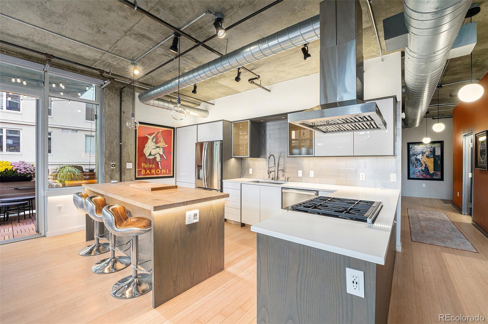 a kitchen that has a stove and a table