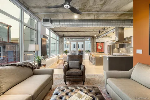 a living room with furniture and a table