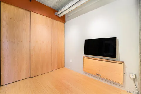a view of a room with a flat screen tv