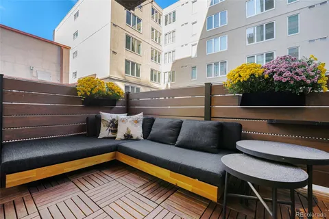 a view of a patio with couches and potted plants