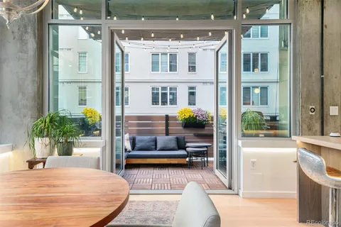 a view of living room kitchen and entryway