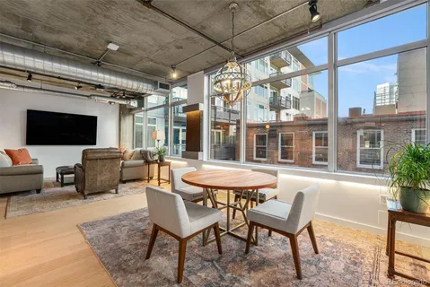 a outdoor space with patio the couches and a dining table with the view of kitchen