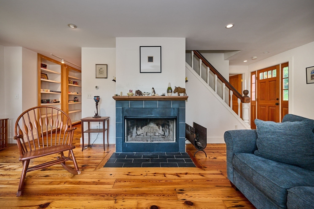 81 Smith Road Ashfield, MA 01330 - Photo 18 of 41 a living room with furniture and a fireplace