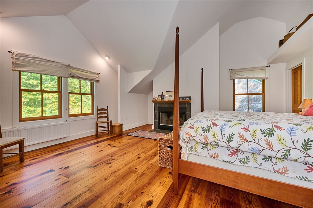 81 Smith Road Ashfield, MA 01330 - Photo 22 of 41 a bedroom with a bed and wooden floor