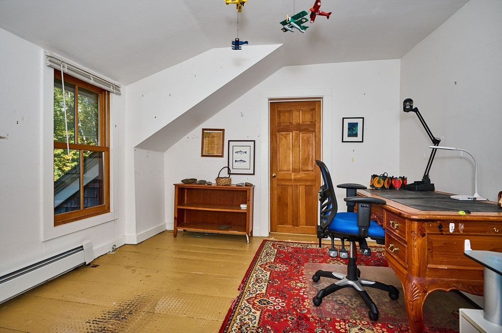 81 Smith Road Ashfield, MA 01330 - Photo 29 of 41 a room with furniture and a window