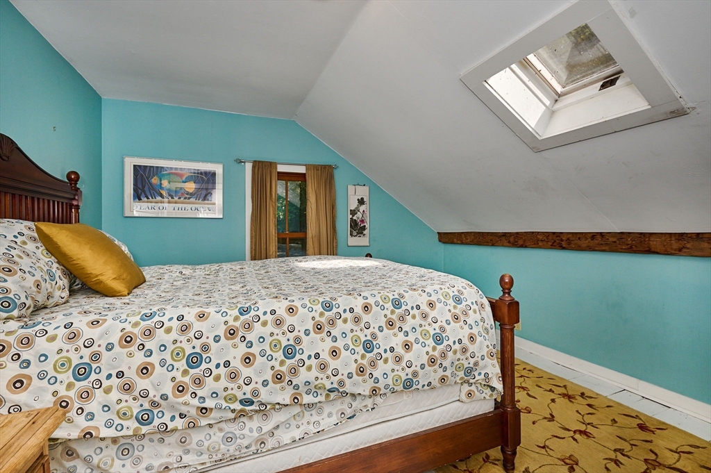 81 Smith Road Ashfield, MA 01330 - Photo 31 of 41 a bedroom with a bed and window
